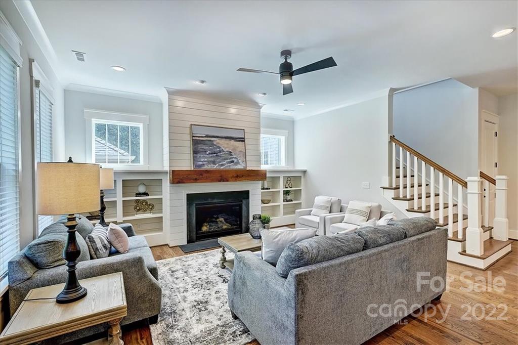 911 Millbrook Road Charlotte, NC 28211 - Photo 21 of 43 a living room with furniture and a fireplace
