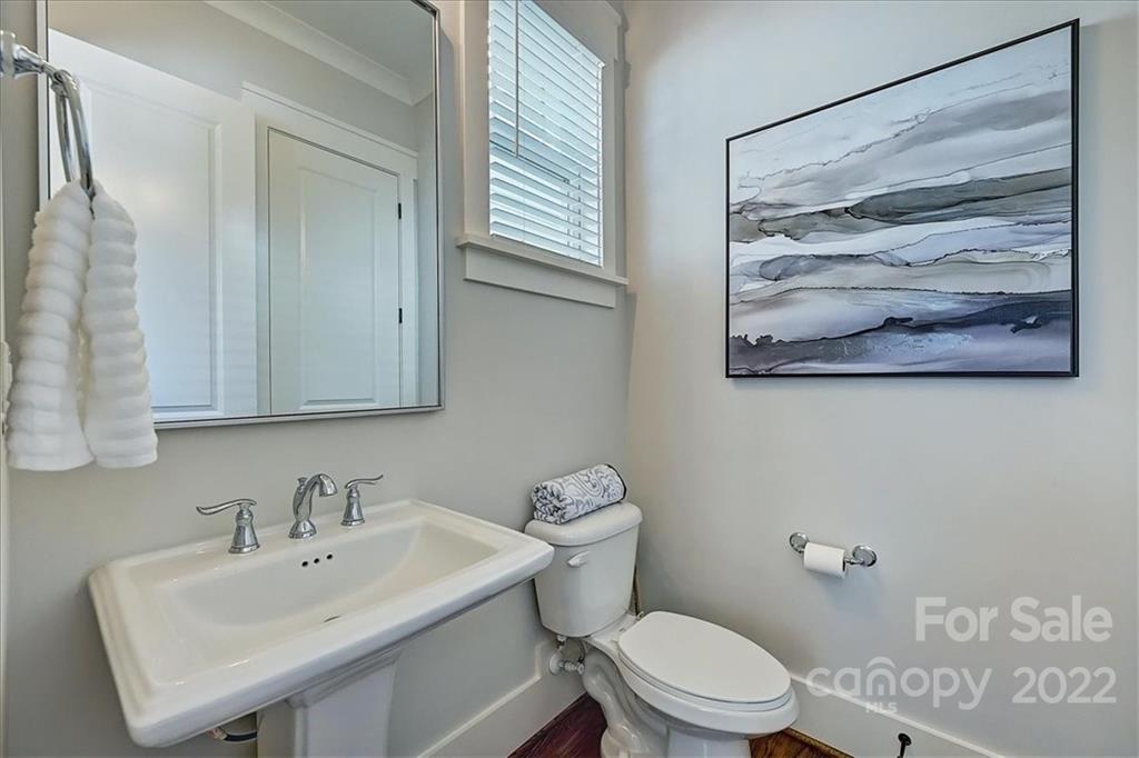 911 Millbrook Road Charlotte, NC 28211 - Photo 23 of 43 a bathroom with a sink and a toilet