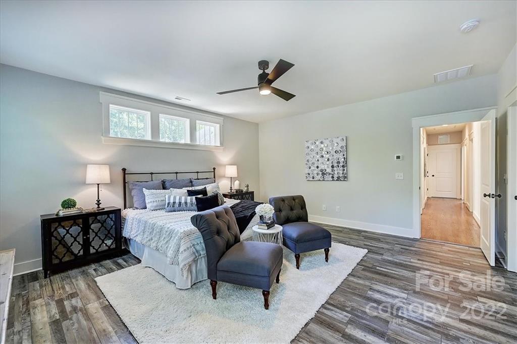 911 Millbrook Road Charlotte, NC 28211 - Photo 28 of 43 a bedroom with furniture and a rug