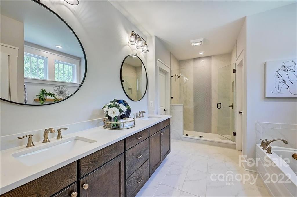 911 Millbrook Road Charlotte, NC 28211 - Photo 29 of 43 a bathroom with a double vanity sink mirror and a mirror