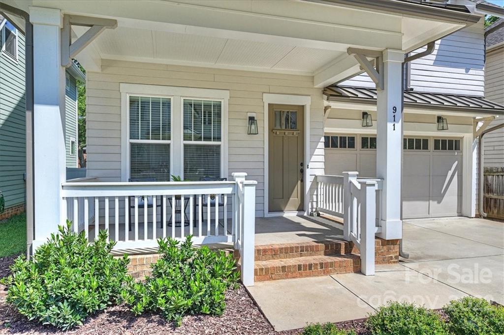 911 Millbrook Road Charlotte, NC 28211 - Photo 3 of 43 a view of a house with a small yard and wooden floor and fence