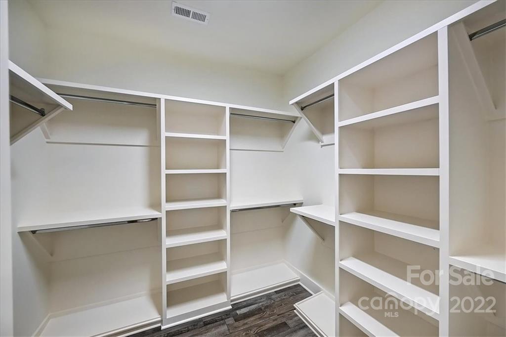 911 Millbrook Road Charlotte, NC 28211 - Photo 32 of 43 a view of walk in closet with empty racks