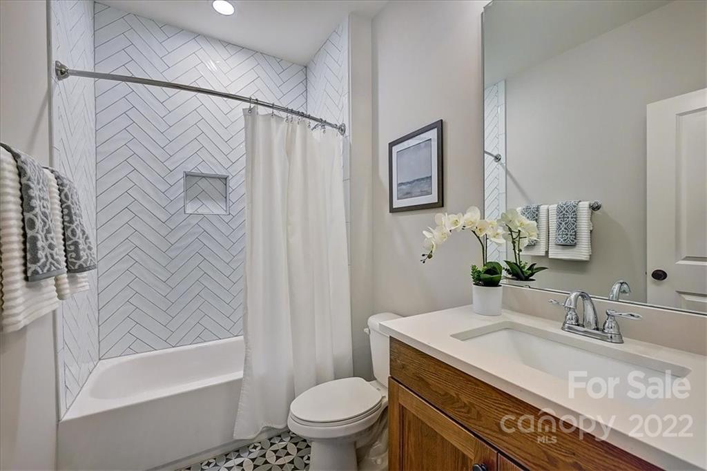911 Millbrook Road Charlotte, NC 28211 - Photo 37 of 43 a bathroom with a granite countertop sink toilet and shower