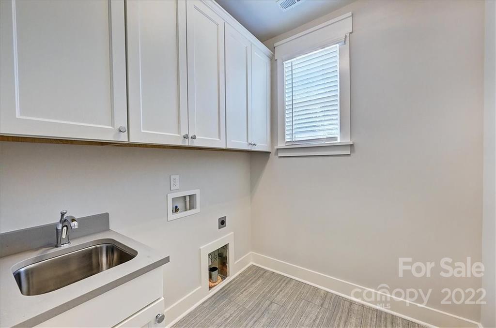 911 Millbrook Road Charlotte, NC 28211 - Photo 40 of 43 a kitchen with sink and cabinets