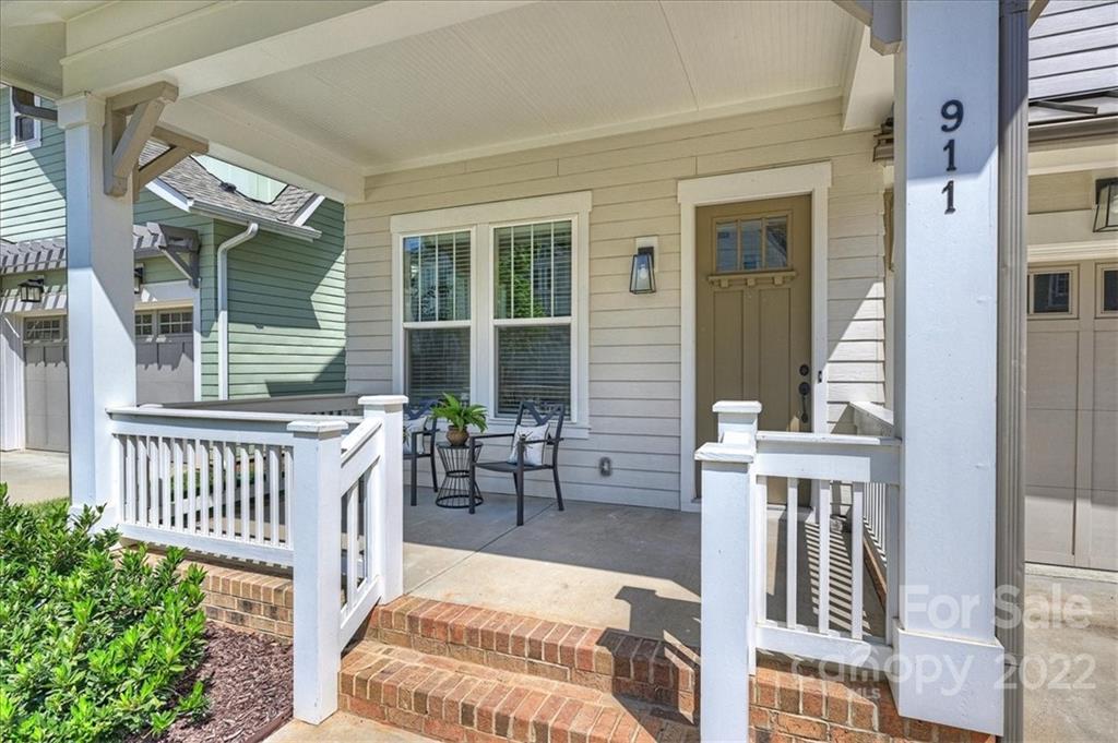 911 Millbrook Road Charlotte, NC 28211 - Photo 4 of 43 a balcony with table and chairs