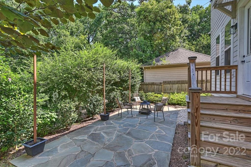 911 Millbrook Road Charlotte, NC 28211 - Photo 41 of 43 a view of a chair and table in backyard