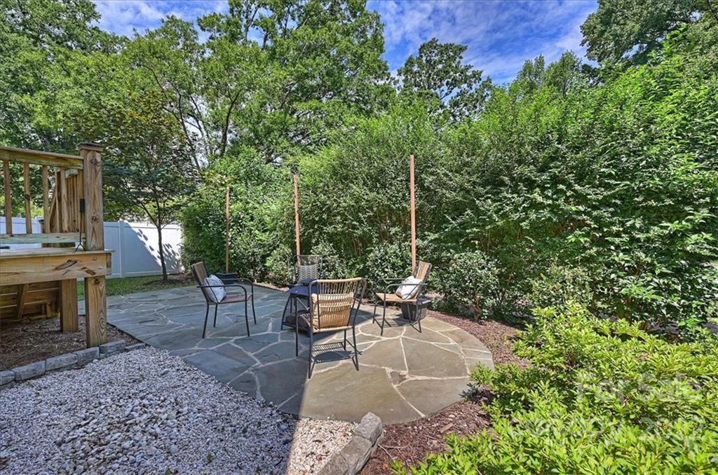 911 Millbrook Road Charlotte, NC 28211 - Photo 43 of 43 a view of a patio with table and chairs and potted plants