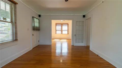 a view of a hallway with washer and dryer