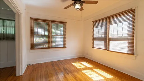 a front view of house with yard outdoor seating and green space