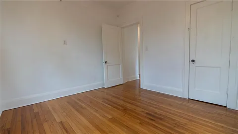 a front view of a house with a garden and deck