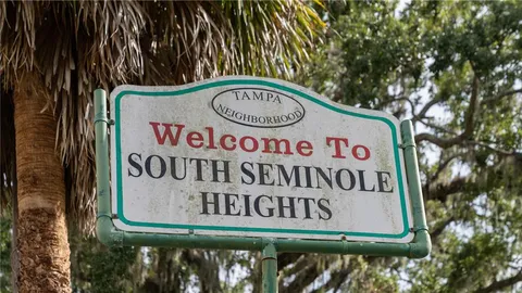a view of a dining room with furniture and window