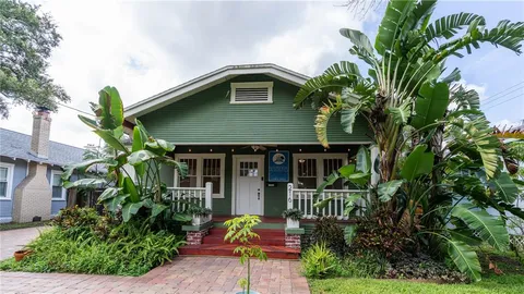 a backyard of a house with lots of green space