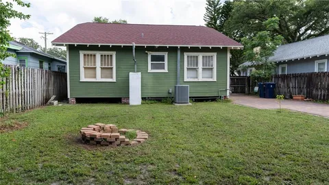 a front view of a building with garden