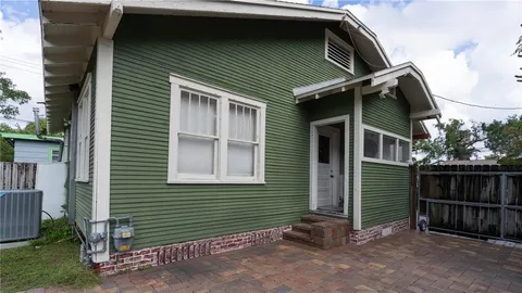 a view of a wooden fence next to a lake