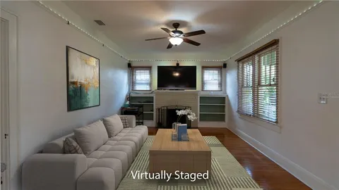 a front view of house with yard outdoor seating and green space