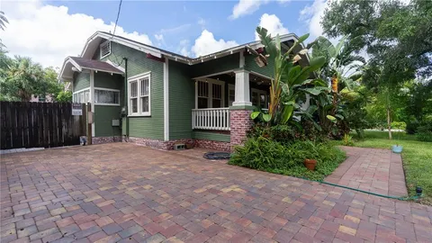 a kitchen with stainless steel appliances kitchen island granite countertop a sink and cabinets