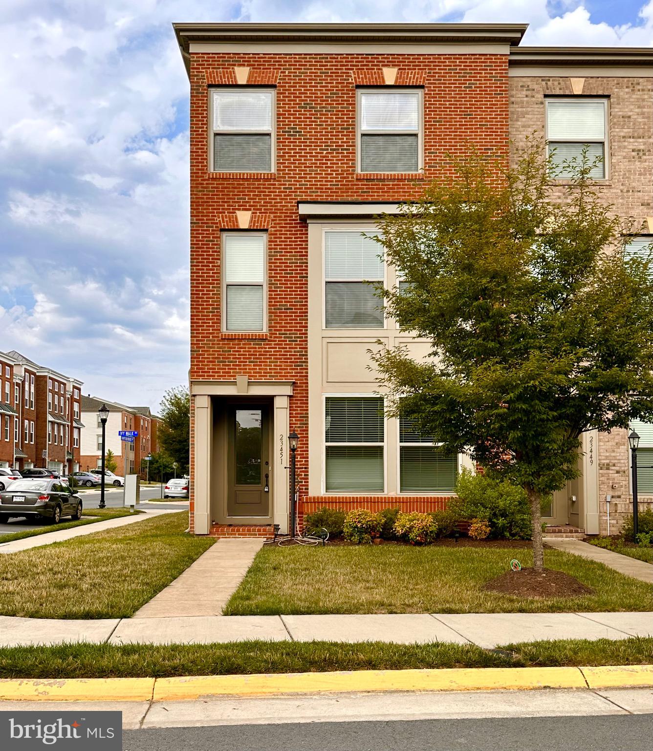 23451 Epperson Square Brambleton, VA 20148 - Photo 1 of 42 a front view of a house having yard