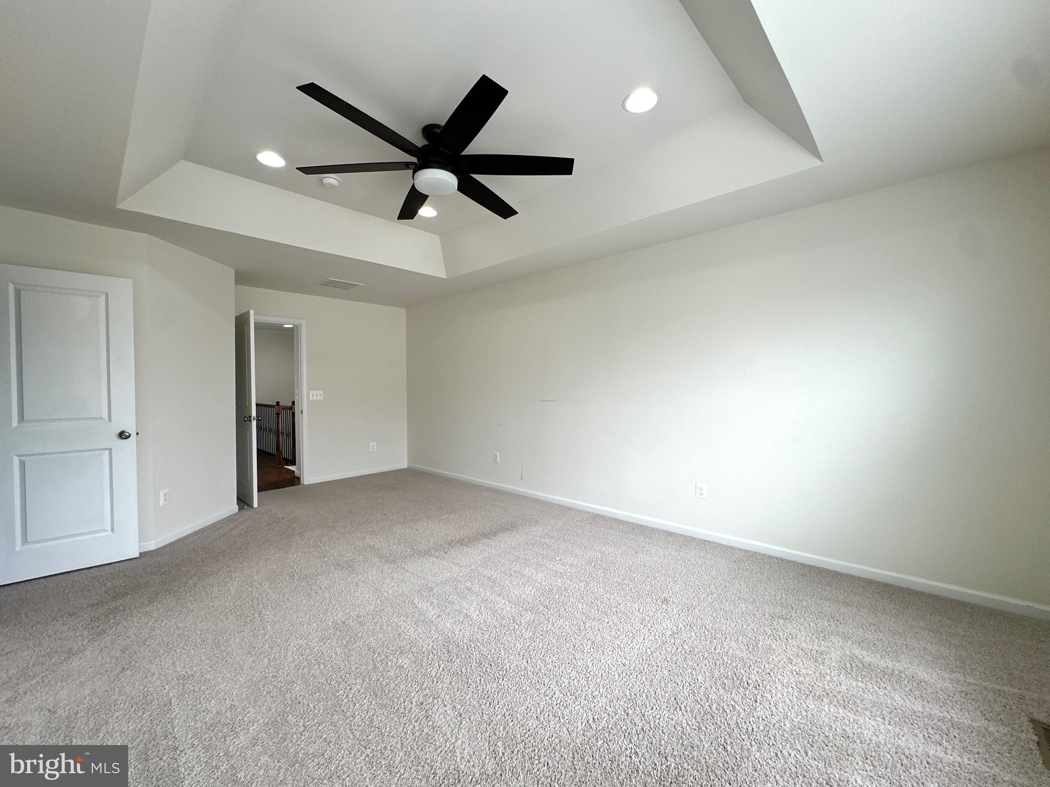 23451 Epperson Square Brambleton, VA 20148 - Photo 26 of 42 a view of an empty room with a ceiling fan