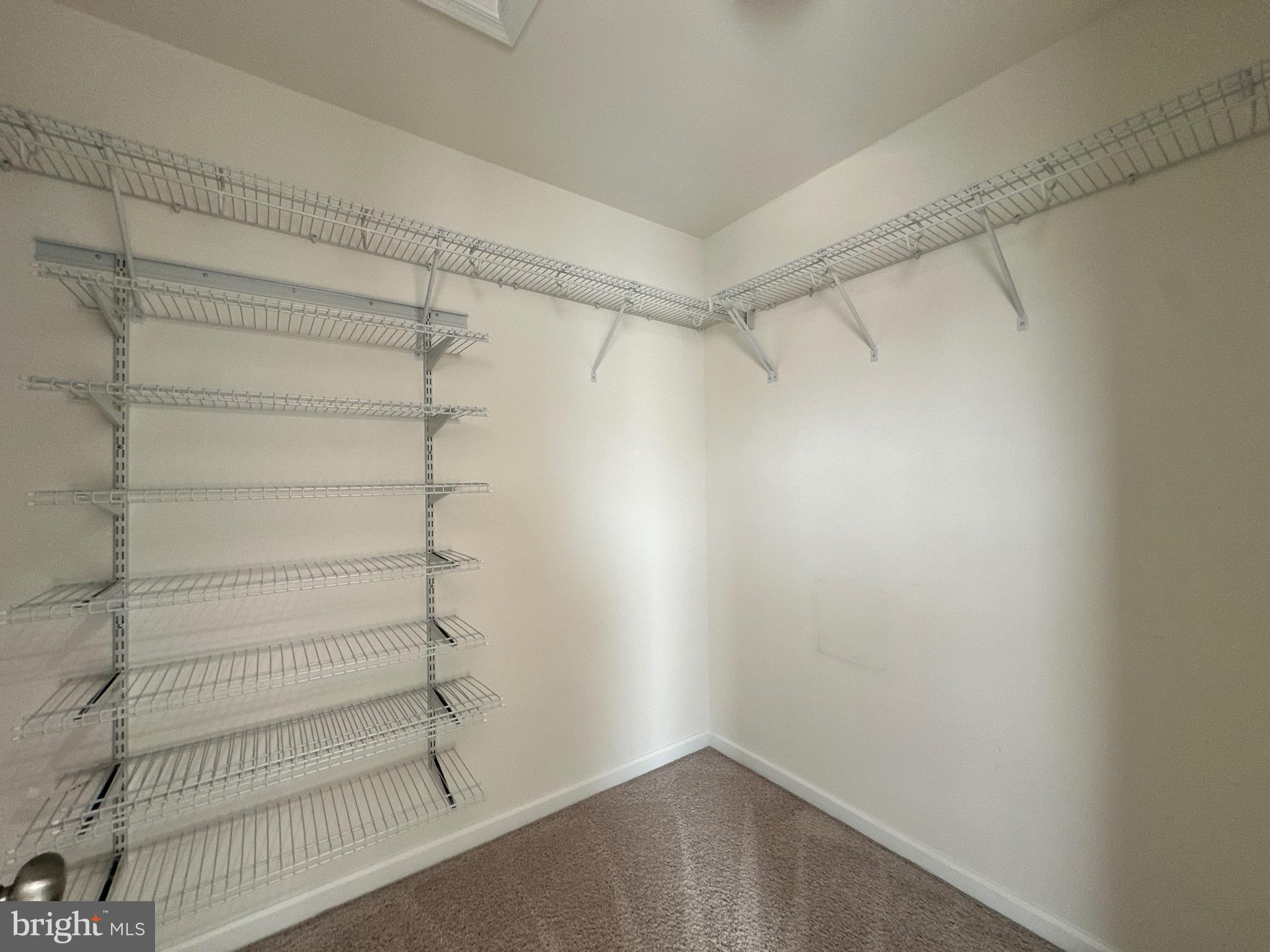 23451 Epperson Square Brambleton, VA 20148 - Photo 27 of 42 a view of a room with shelf