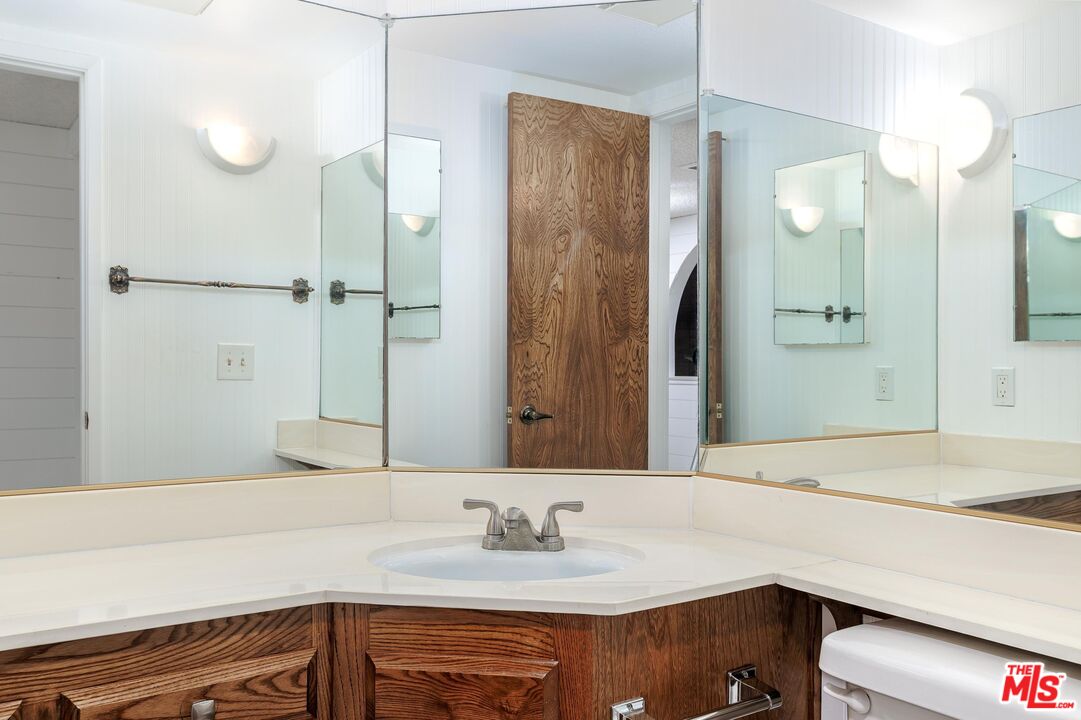 1108 Via Mavis Santa Maria, CA 93455 - Photo 19 of 28 a bathroom with a sink and a mirror