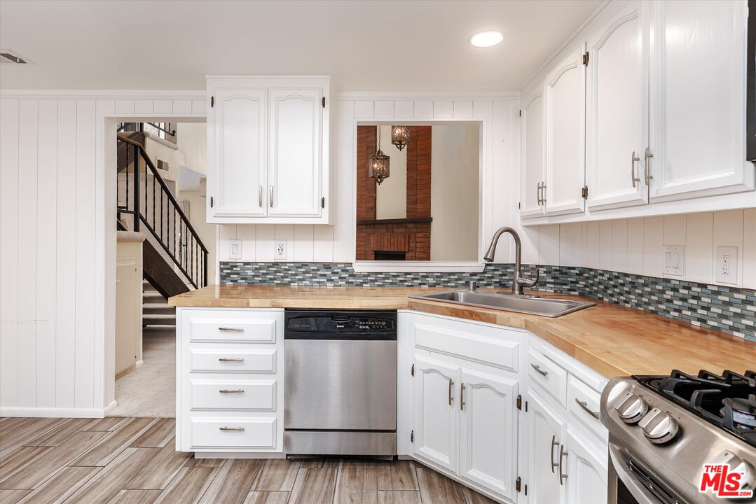 1108 Via Mavis Santa Maria, CA 93455 - Photo 10 of 28 a kitchen with granite countertop a stove and a sink
