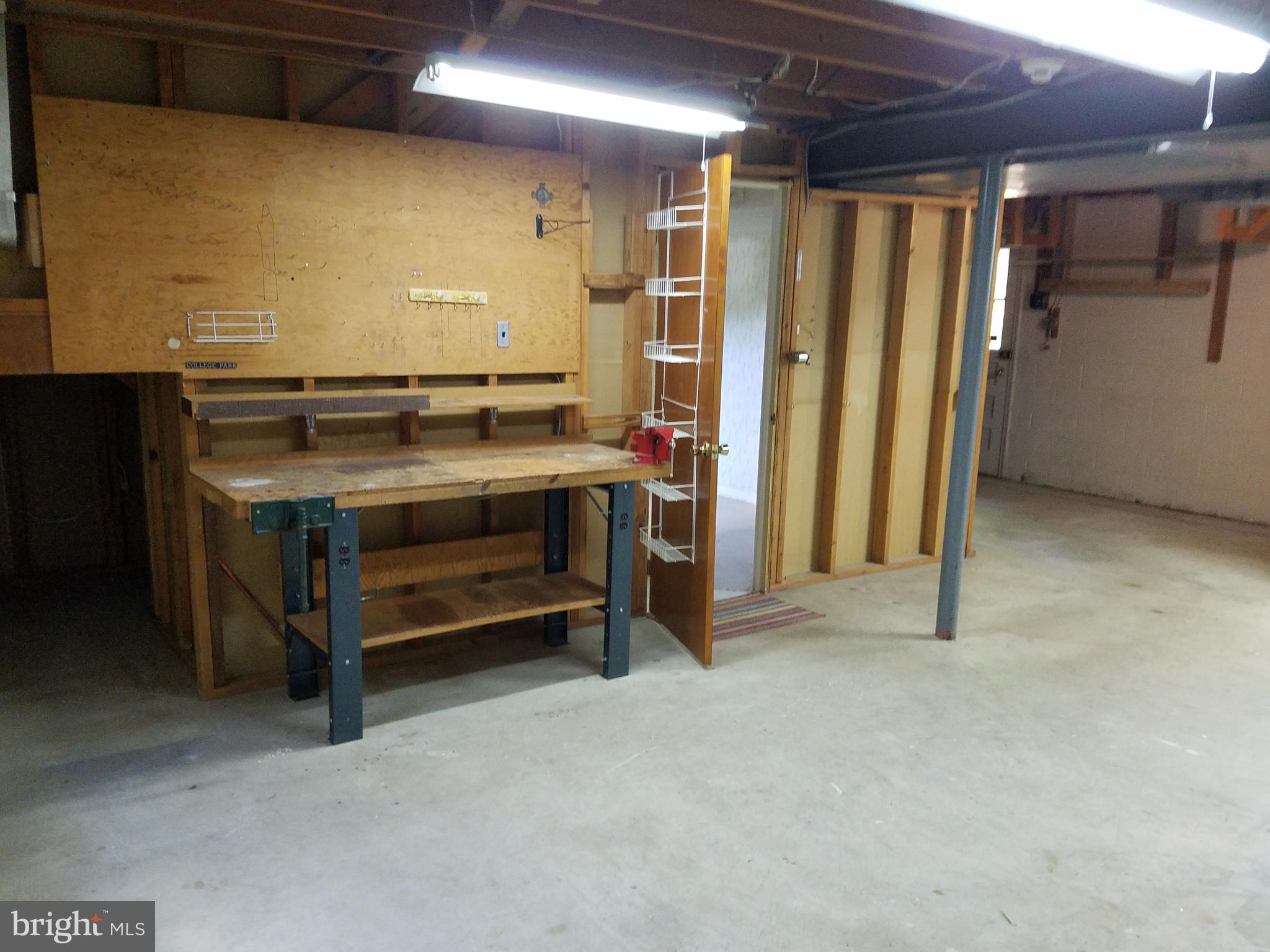 5903 Windham Road Laurel, MD 20707 - Photo 15 of 16 Workshop with bench and electricity.