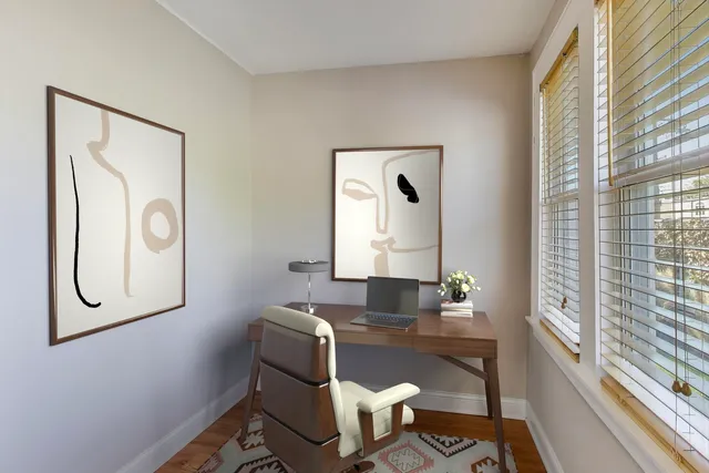a view of a room with wooden floor and fence