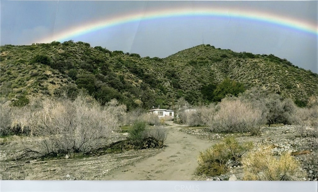 1 of 5 residences and huge antenna on hill below center of rainbow...........