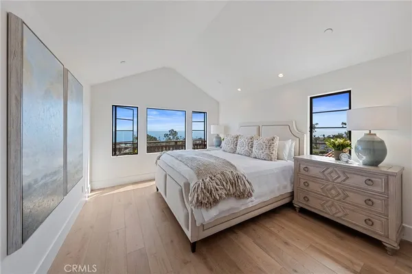 a bedroom with a bed window and a dresser