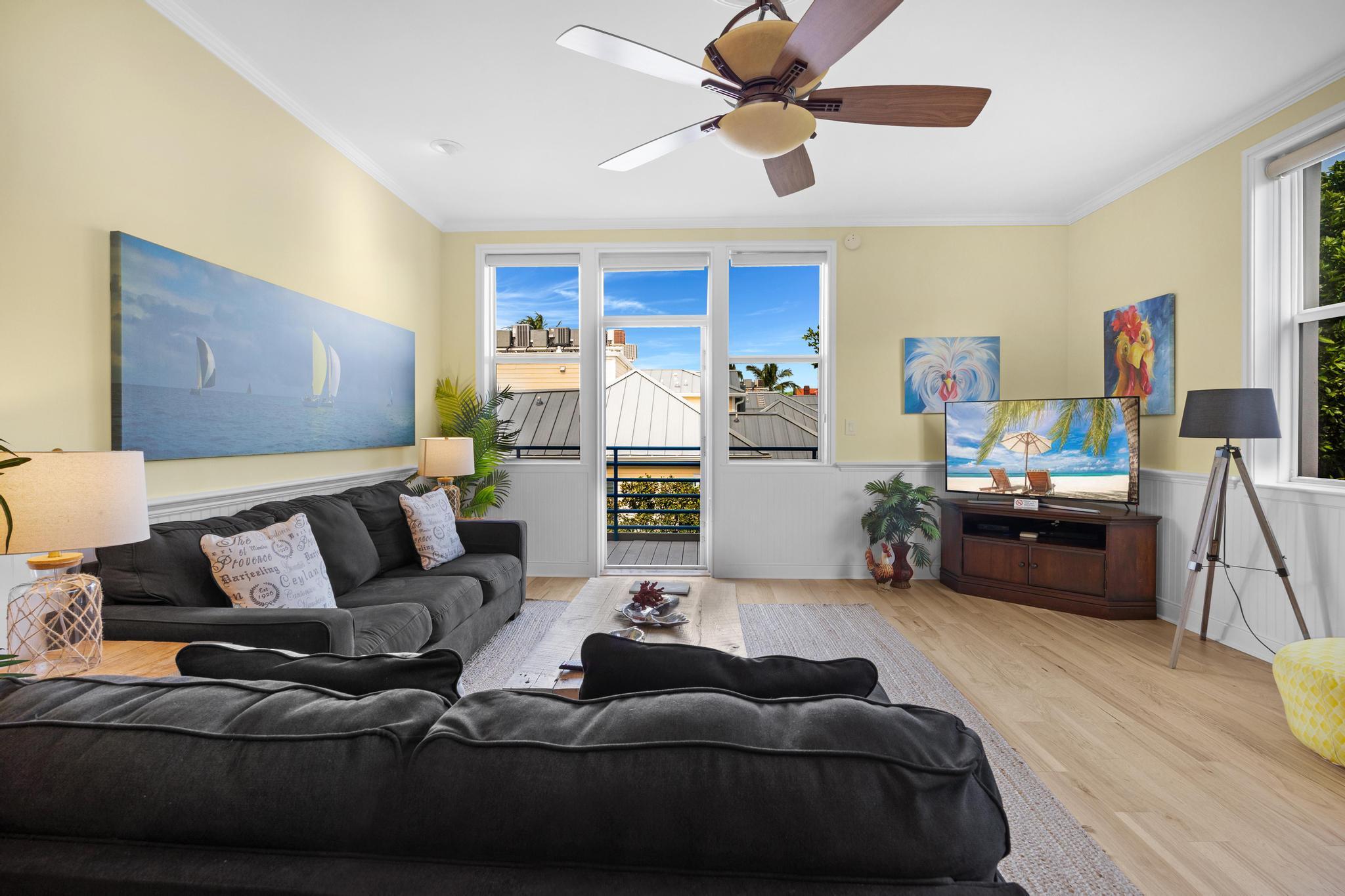 115 Front Street, Unit 301 Key West, FL 33040 - Photo 17 of 52 a living room with furniture and a wooden floor