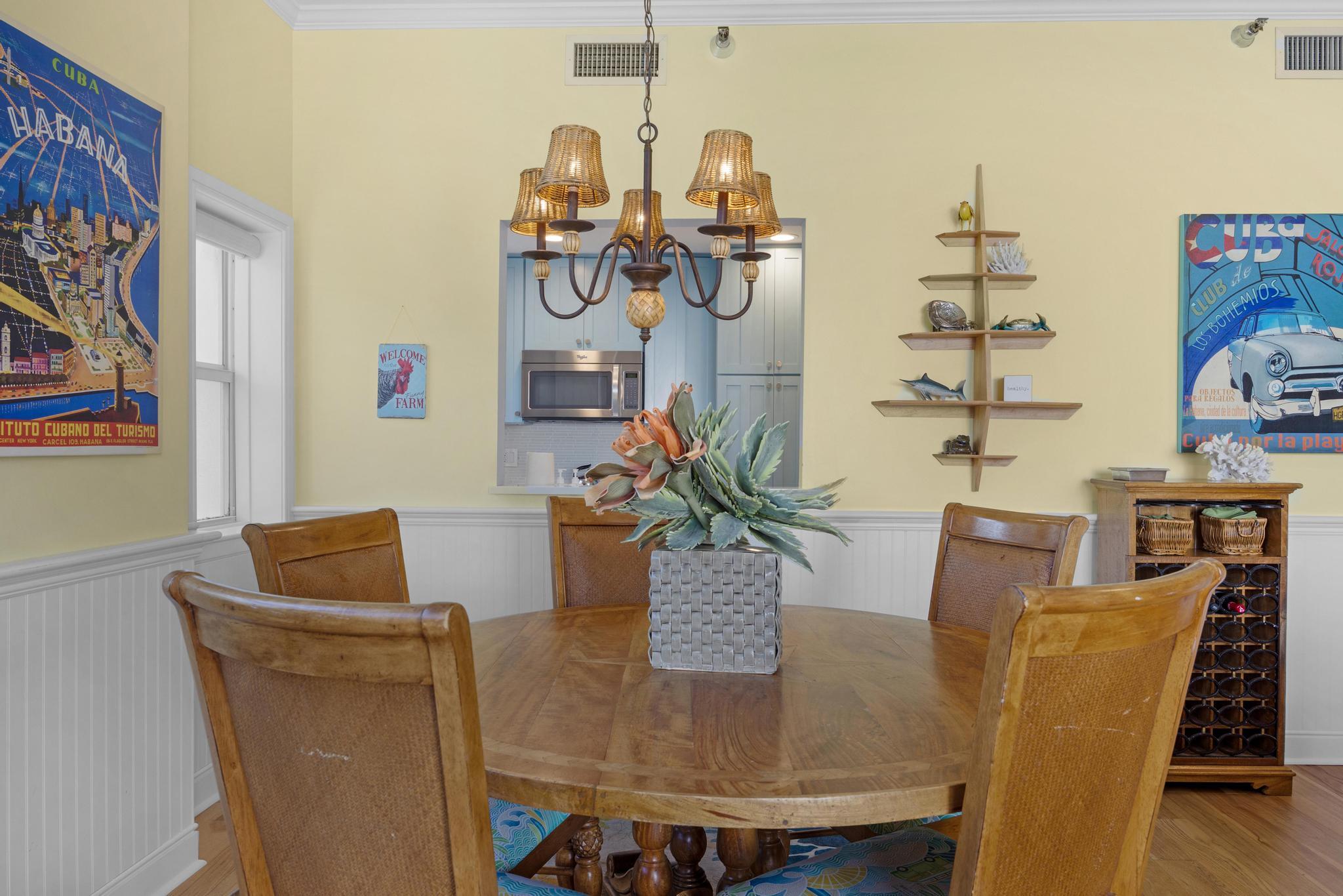 115 Front Street, Unit 301 Key West, FL 33040 - Photo 20 of 52 a dining room with furniture and wooden floor