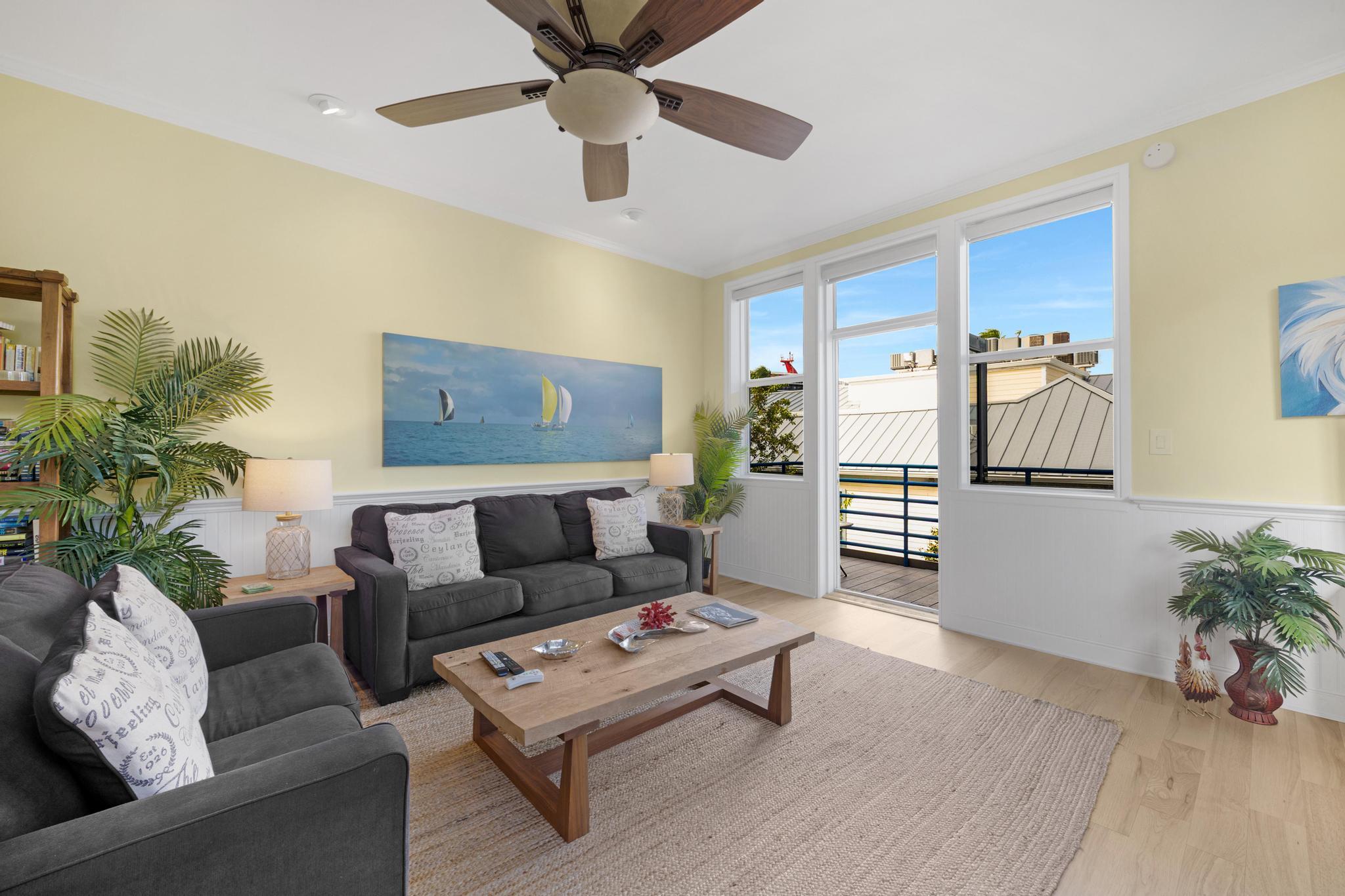 115 Front Street, Unit 301 Key West, FL 33040 - Photo 21 of 52 a living room with furniture and a potted plant