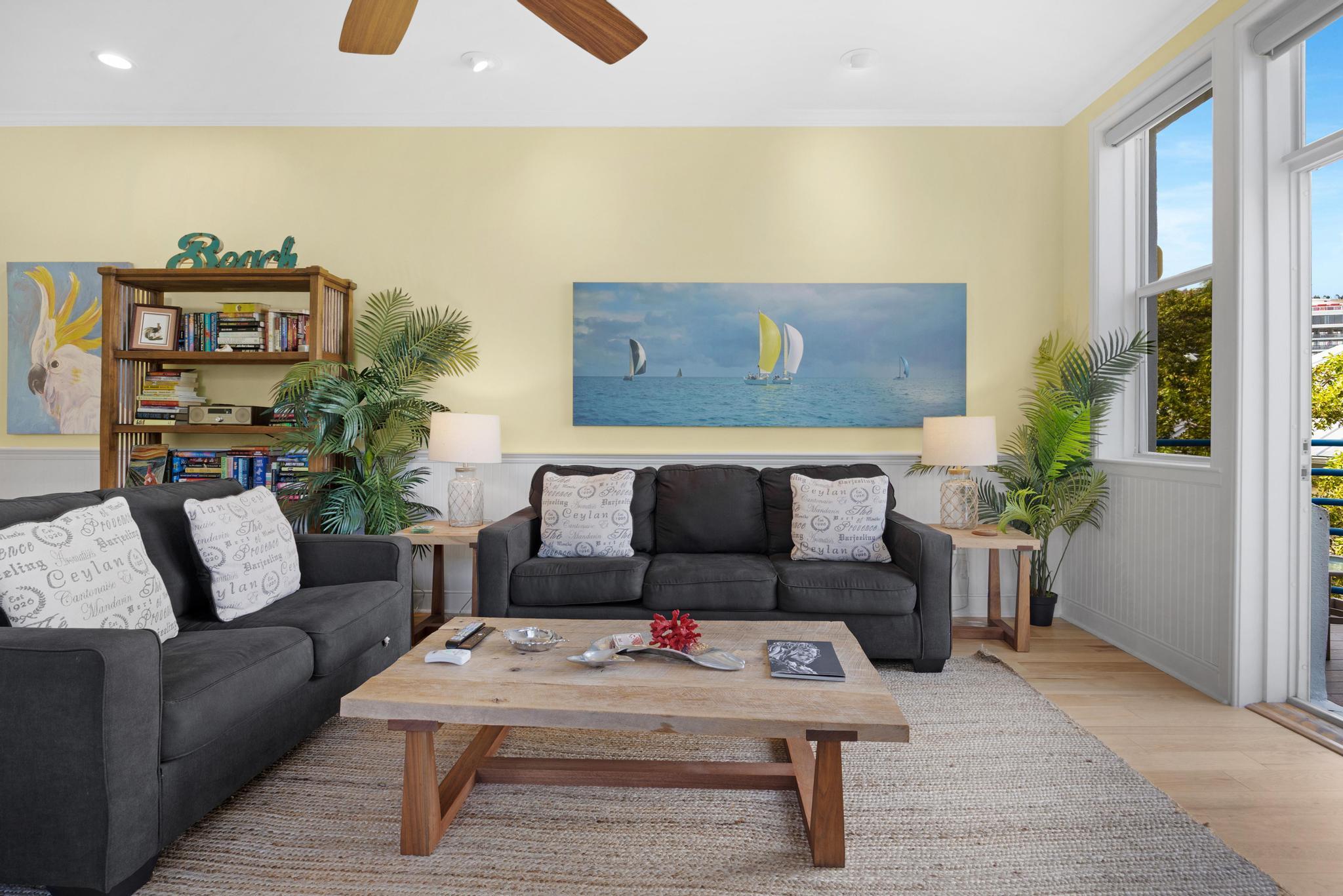 115 Front Street, Unit 301 Key West, FL 33040 - Photo 22 of 52 a living room with furniture and a flat screen tv