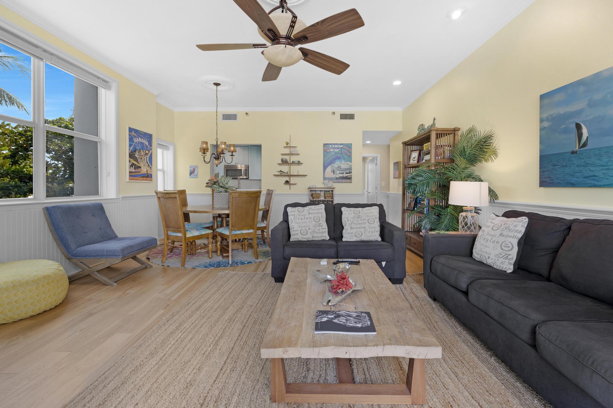 115 Front Street, Unit 301 Key West, FL 33040 - Photo 23 of 52 a living room with furniture and wooden floor