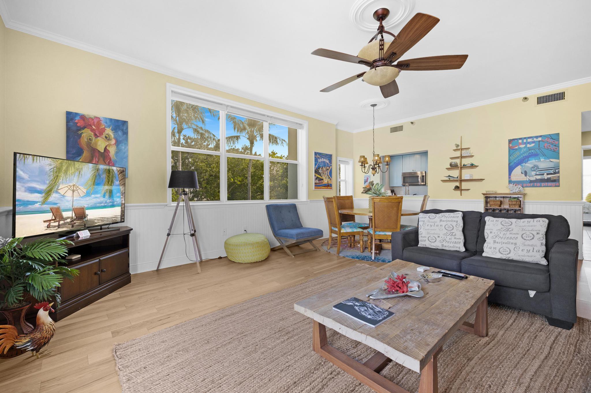 115 Front Street, Unit 301 Key West, FL 33040 - Photo 24 of 52 a living room with furniture and a flat screen tv