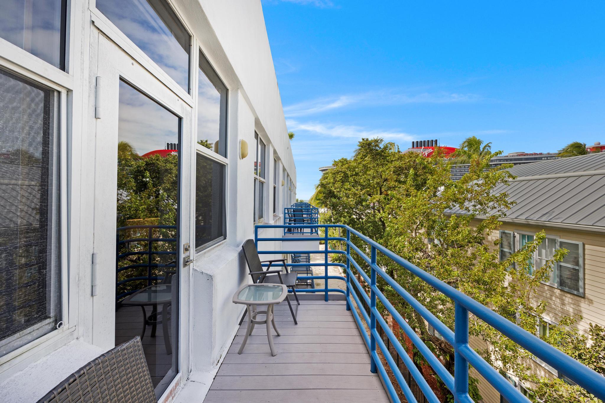 115 Front Street, Unit 301 Key West, FL 33040 - Photo 25 of 52 a view of balcony with wooden floor and fence