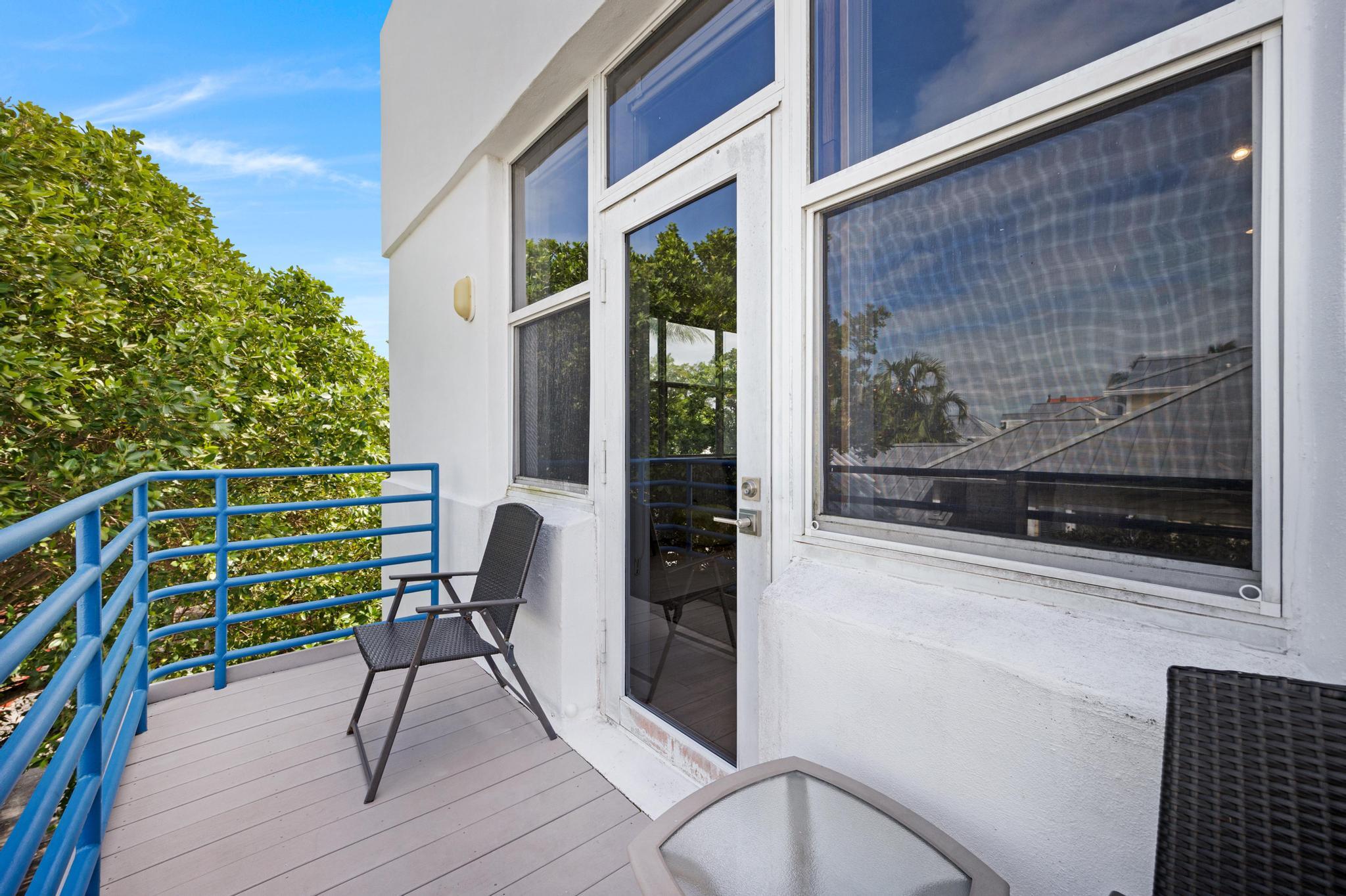 115 Front Street, Unit 301 Key West, FL 33040 - Photo 27 of 52 a view of a chair and table in the balcony