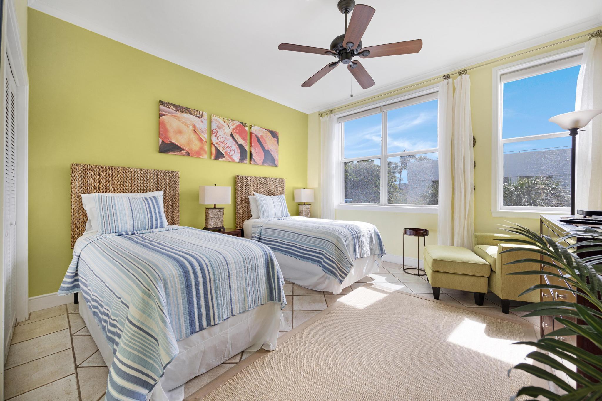 115 Front Street, Unit 301 Key West, FL 33040 - Photo 3 of 52 a bedroom with a bed couch and window