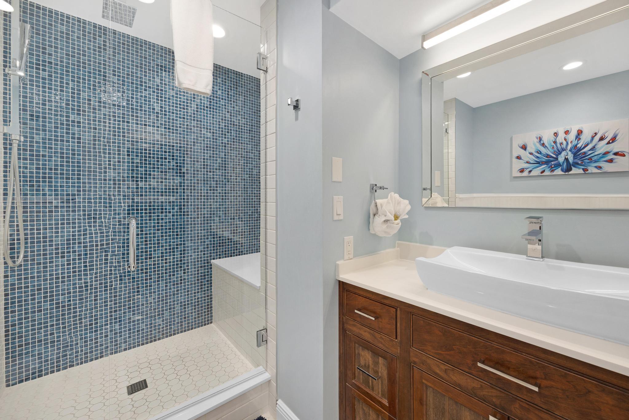 115 Front Street, Unit 301 Key West, FL 33040 - Photo 37 of 52 a bathroom with a sink a toilet and shower