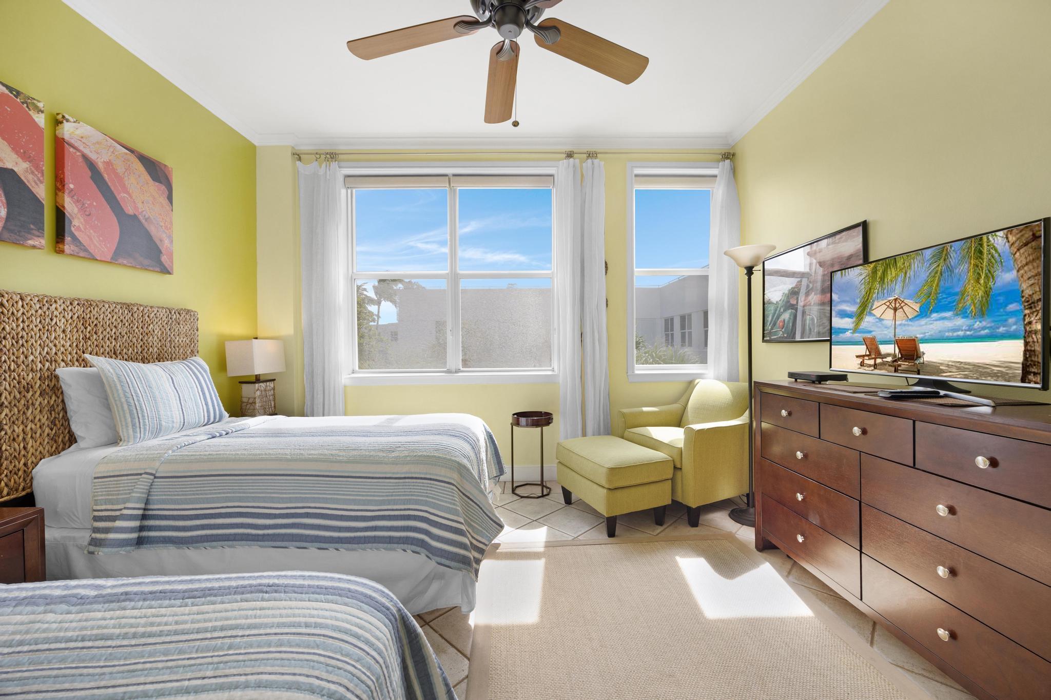 115 Front Street, Unit 301 Key West, FL 33040 - Photo 4 of 52 a bedroom with a bed and window