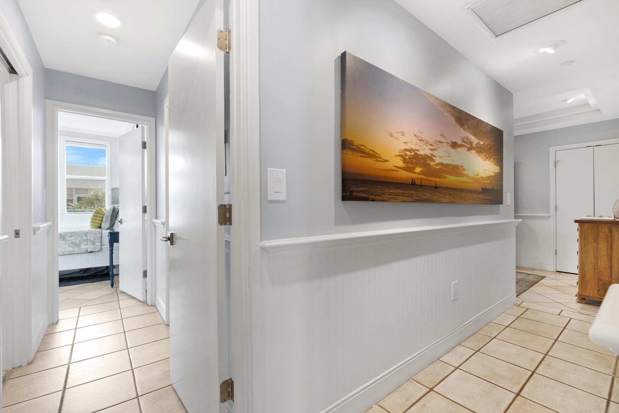 115 Front Street, Unit 301 Key West, FL 33040 - Photo 9 of 52 a view of a hallway with wooden floor and cabinet
