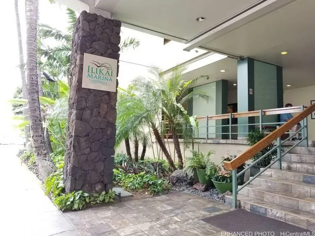 a view of an entryway with a floor to ceiling window