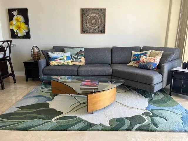 a living room with furniture and a rug