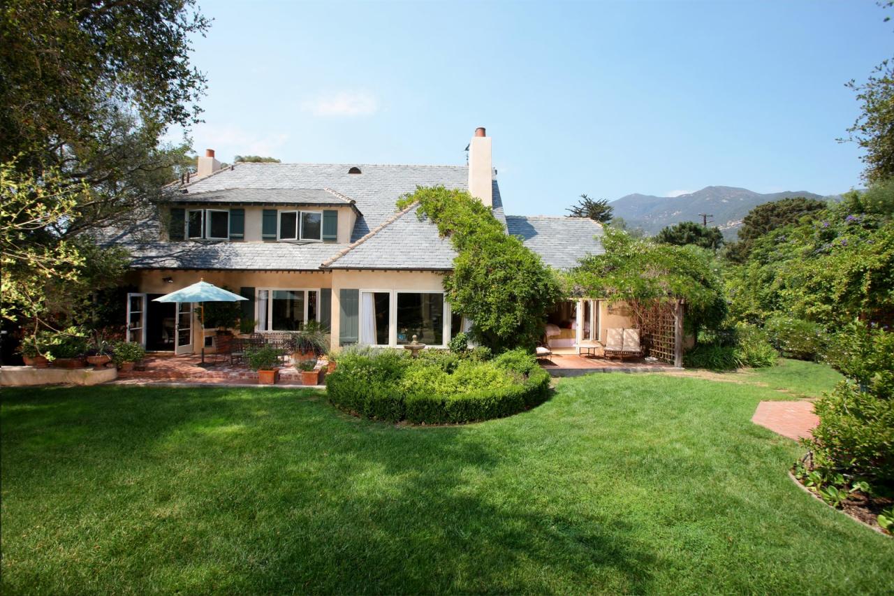 610 San Ysidro Road Montecito, CA 93108 - Photo 7 of 8 a front view of a house with a garden and plants