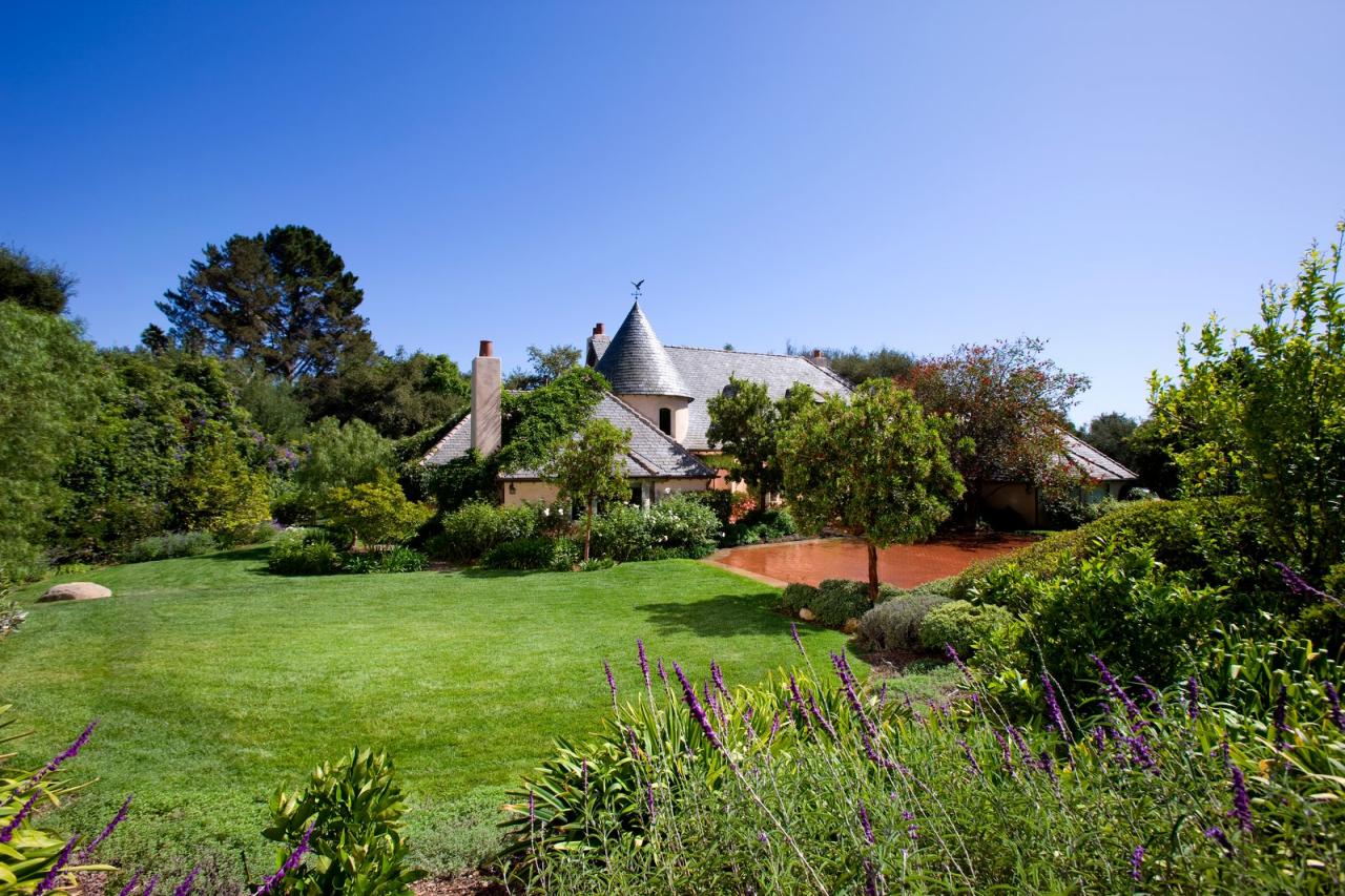 610 San Ysidro Road Montecito, CA 93108 - Photo 8 of 8 a view of a garden with a building in the background