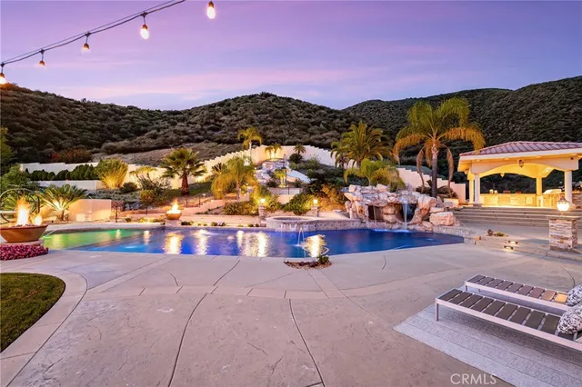 a view of a house with swimming pool