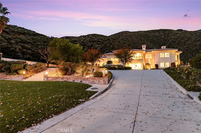 a view of a swimming pool with an outdoor seating and a potted plants