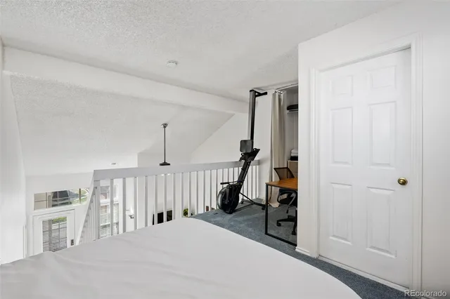 a view of a room with a table and a chair