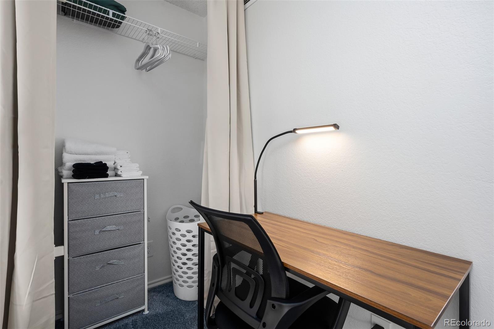 3016 West Prentice Avenue, Unit D Littleton, CO 80123 - Photo 20 of 28 a view of a room with a table and a chair