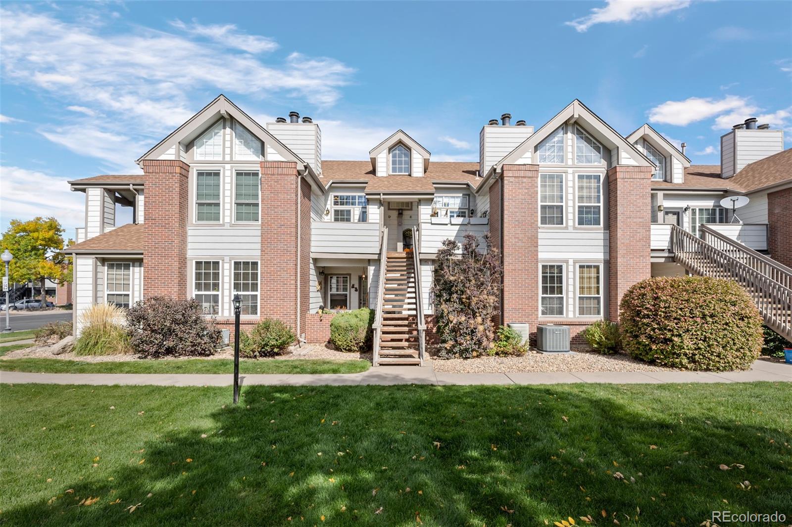 3016 West Prentice Avenue, Unit D Littleton, CO 80123 - Photo 23 of 28 a view of a front of house with a yard